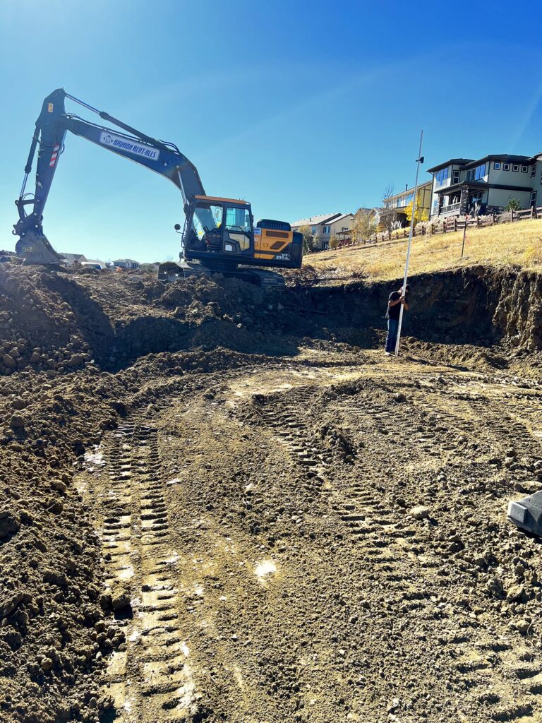 Retaining wall excavation and preparation by CJB's Excavation Colorado for property enhancement.
